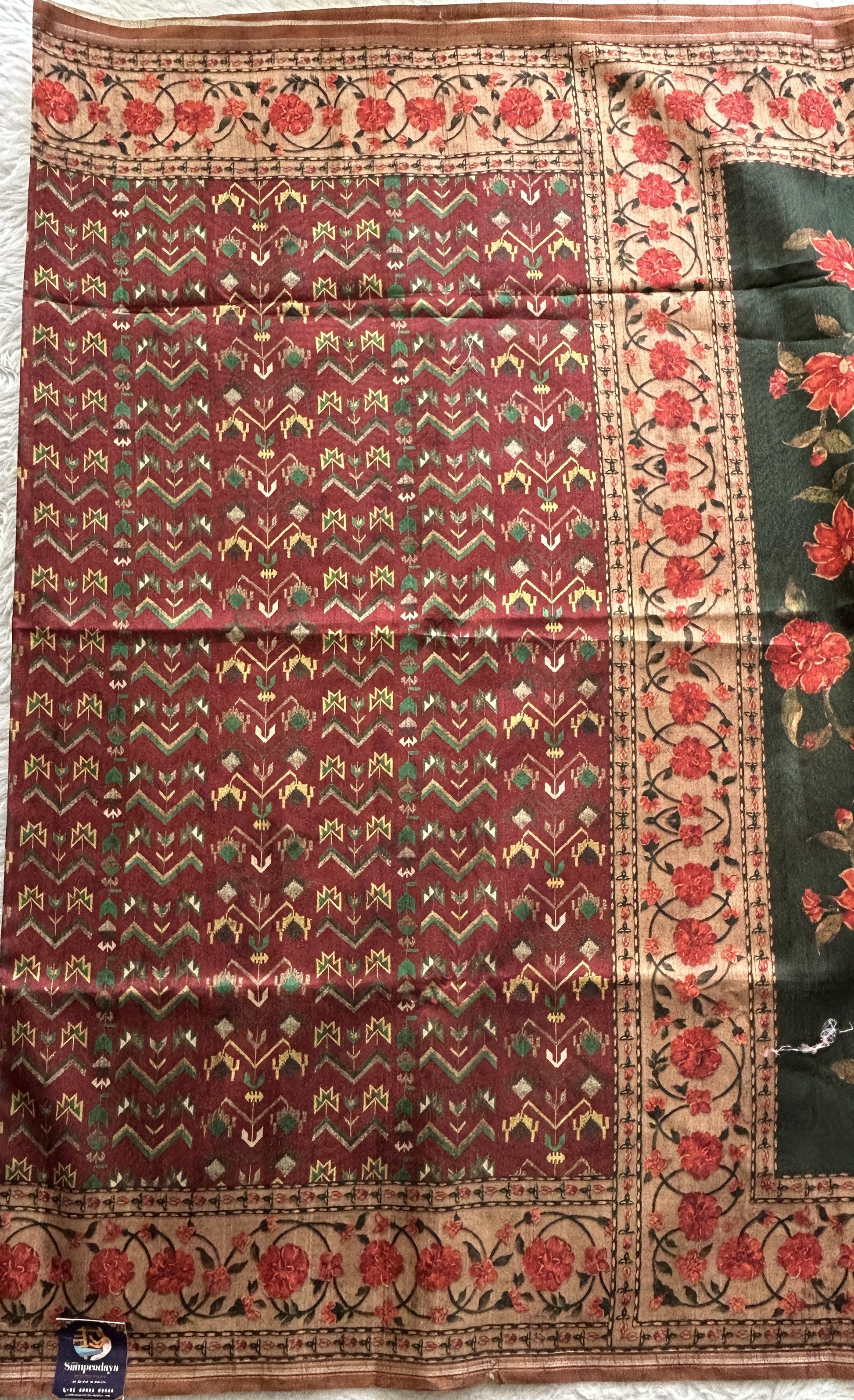 Semi Tussar Saree Bottle Green Colored complemented with a Floral Print Border. - Sampradaya Designer Studio