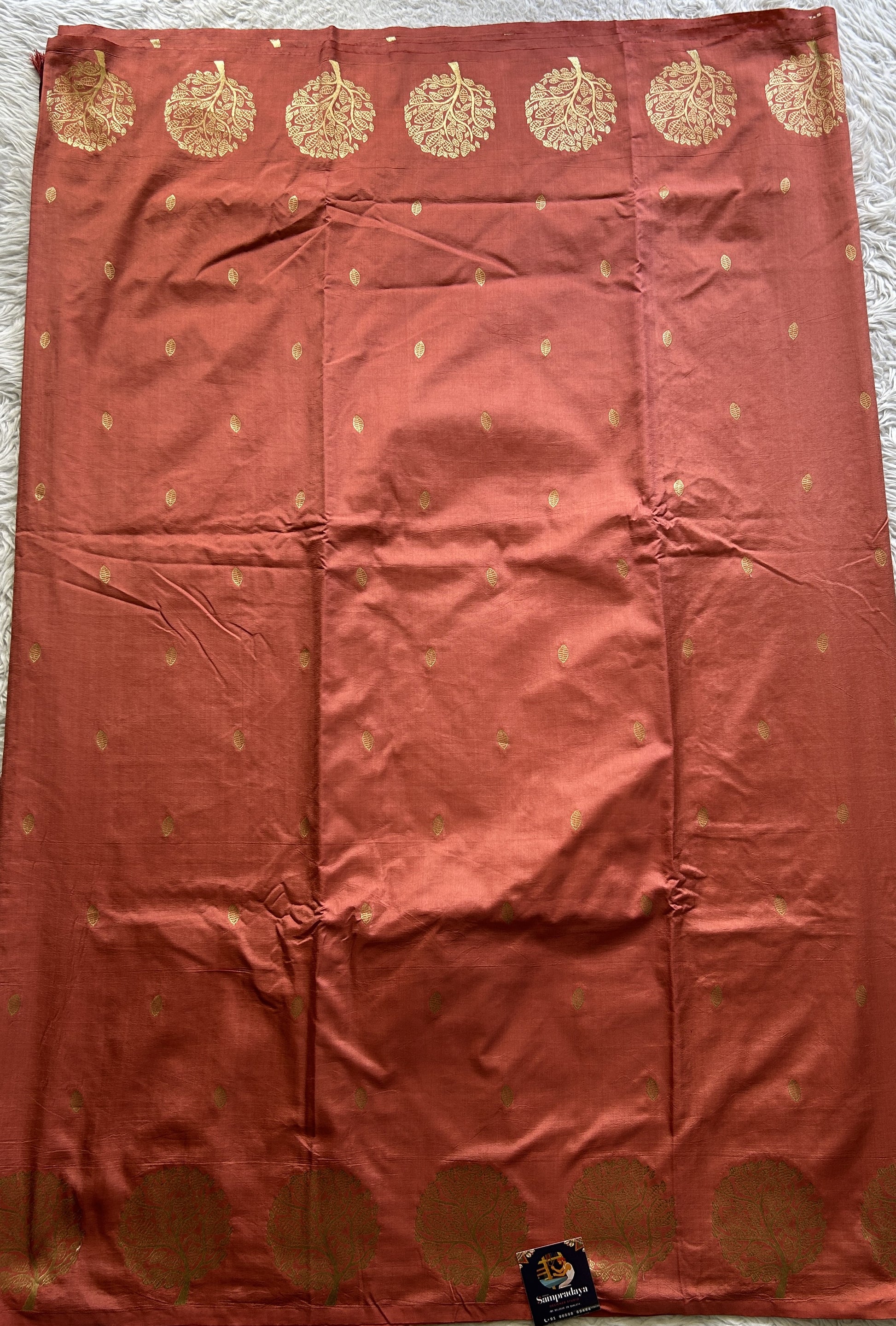 Mona Silk Saree Peach Colored Paired with a Buti Border. - Sampradaya Designer Studio