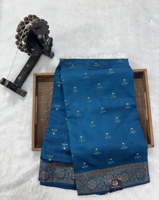 Pure Chiniya Silk Saree Teal Blue Colored Elegantly Paired with a Gold Zari Border.