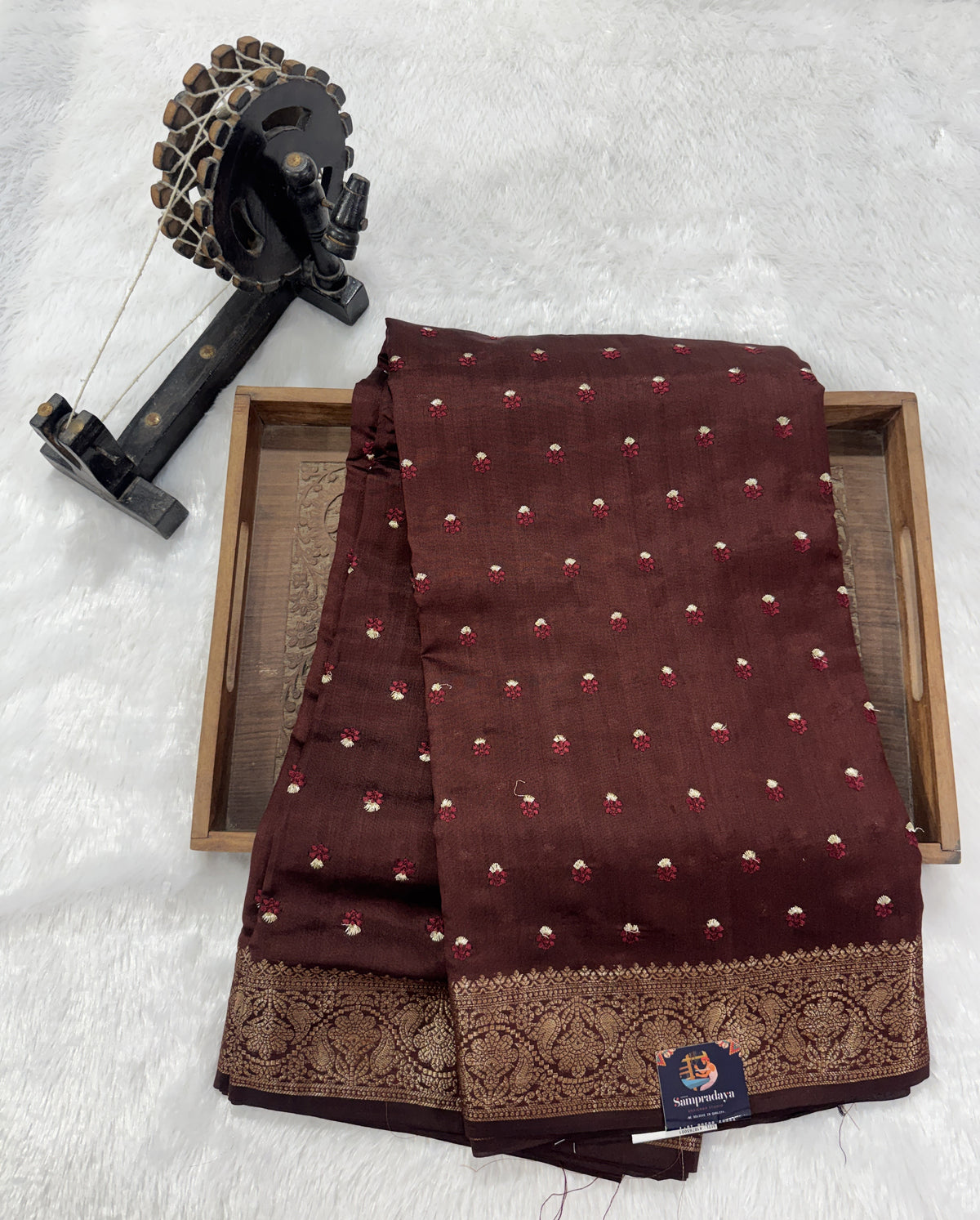 Pure Chiniya Silk Saree Brown Colored Elegantly Paired with a Gold Zari Border.
