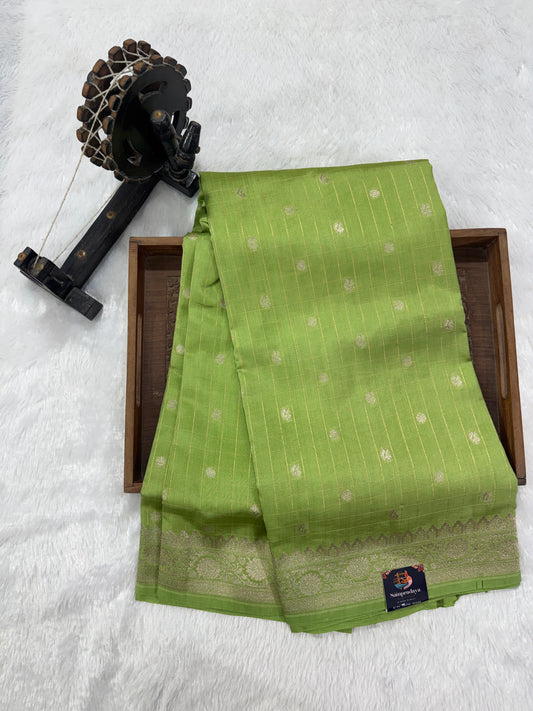 Pure Chiniya Silk Saree Apple Green Colored Elegantly Paired with a Gold Zari Border.