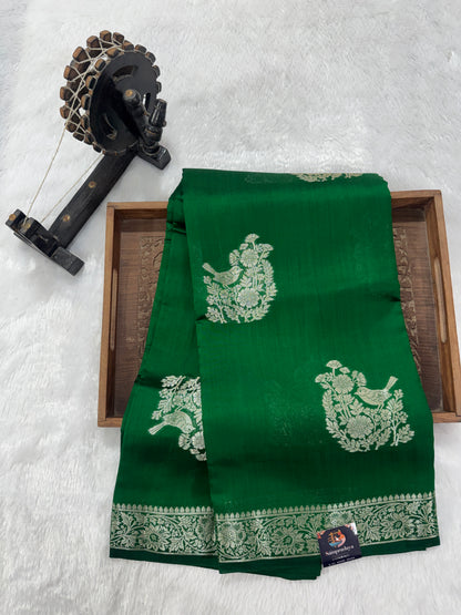 Pure Chiniya Silk Saree Bottle Green Colored Elegantly Paired with a Gold Zari Border.