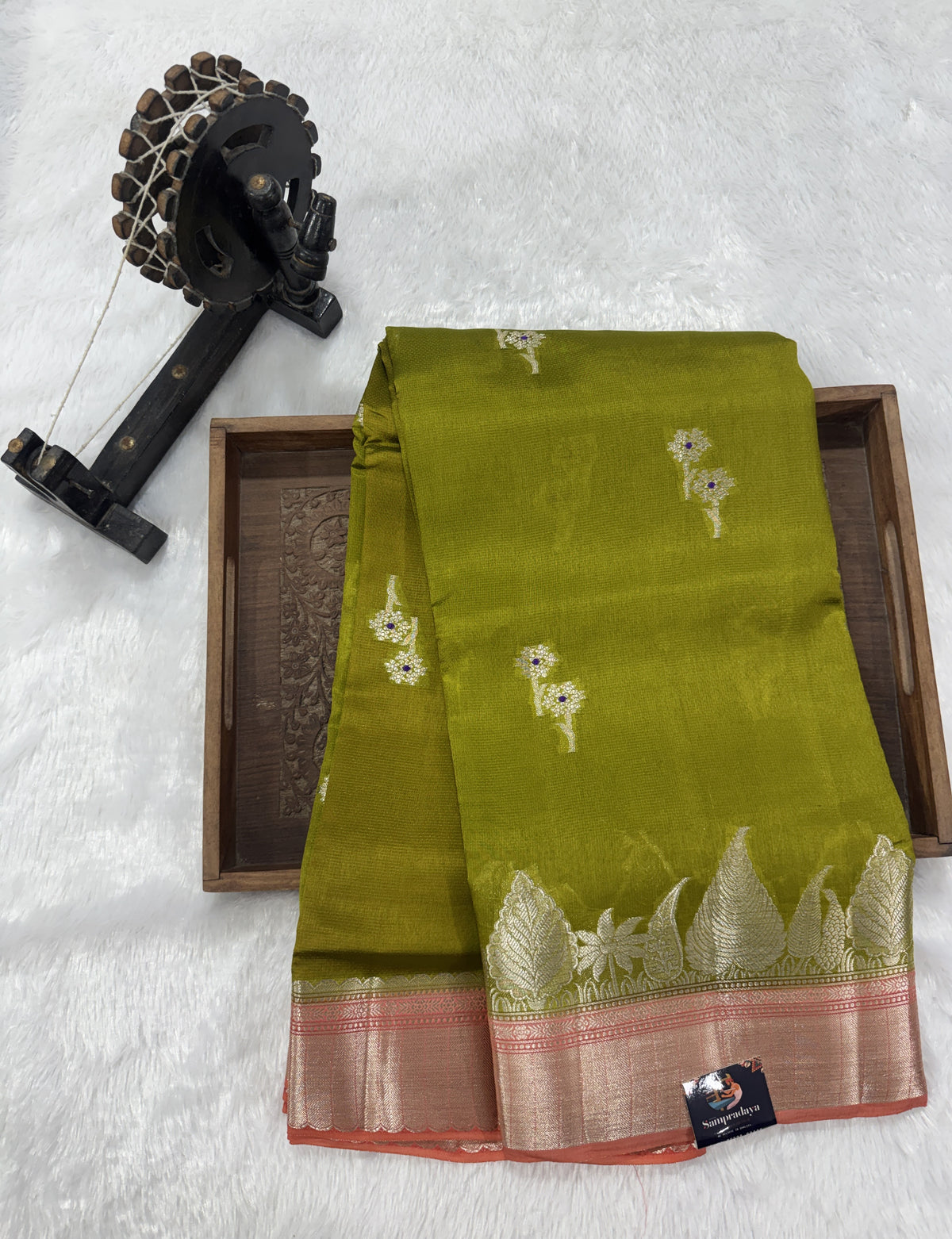 Pure Chiniya Silk Saree Mehandi Colored Elegantly Paired with a Gold Zari Border.