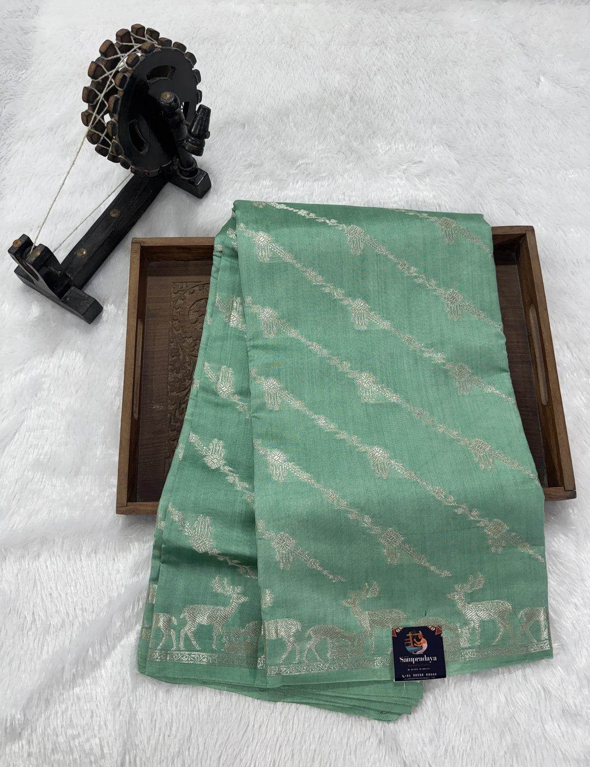 Pure Chiniya Silk Saree Sea Green Colored Elegantly Paired with a Gold Zari Border.