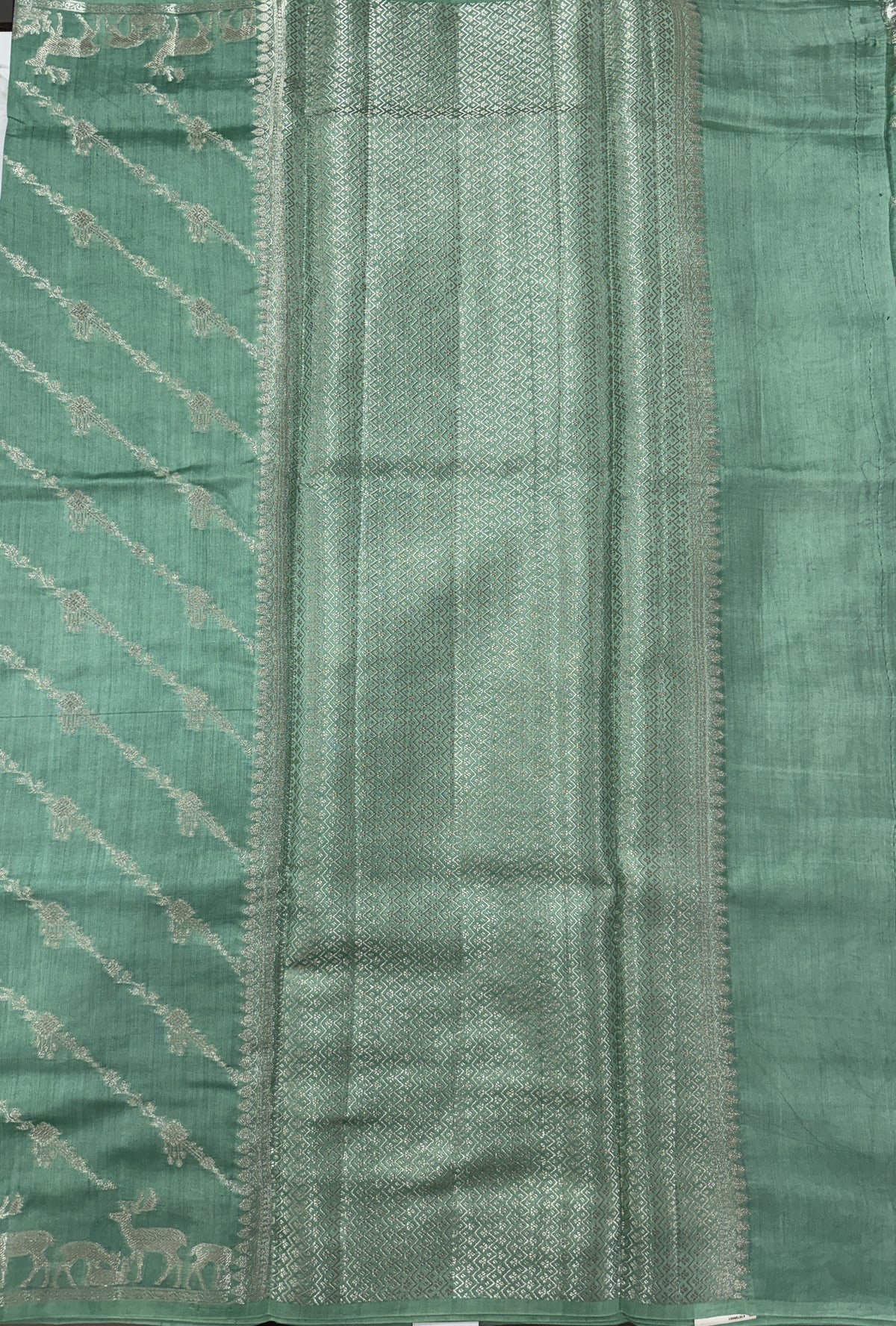 Pure Chiniya Silk Saree Sea Green Colored Elegantly Paired with a Gold Zari Border.