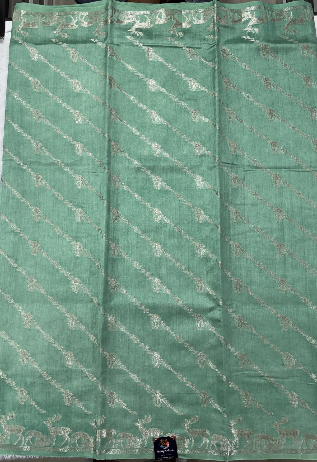 Pure Chiniya Silk Saree Sea Green Colored Elegantly Paired with a Gold Zari Border.