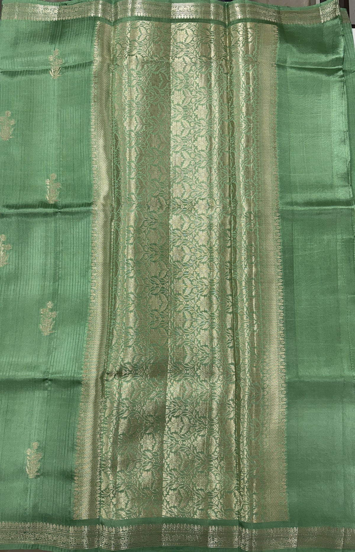 Pure Chiniya Silk Saree Sea Green Colored Elegantly Paired with a Gold Zari Border.