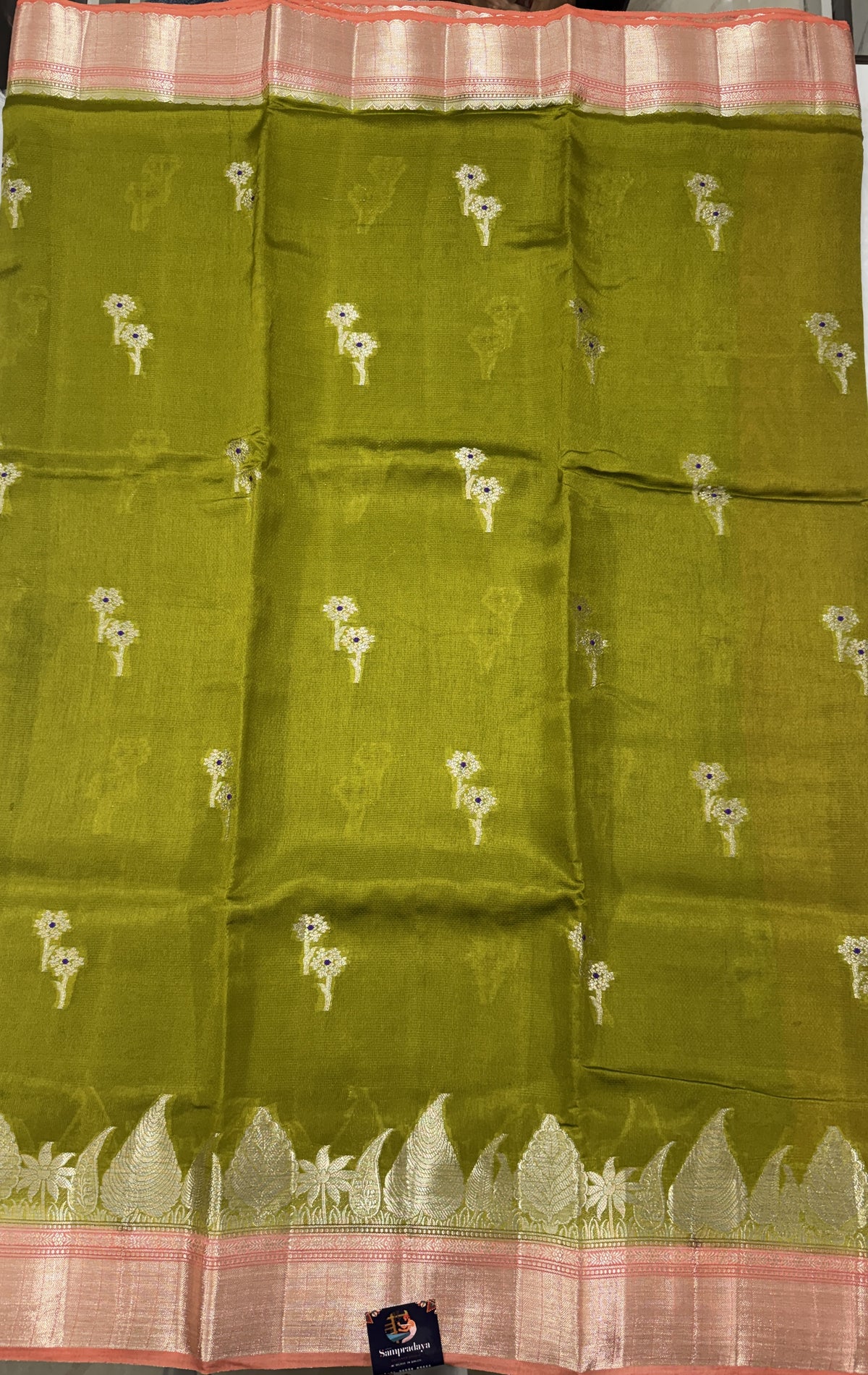 Pure Chiniya Silk Saree Mehandi Colored Elegantly Paired with a Gold Zari Border.