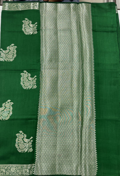 Pure Chiniya Silk Saree Bottle Green Colored Elegantly Paired with a Gold Zari Border.