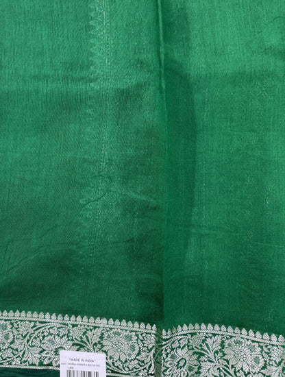 Pure Chiniya Silk Saree Bottle Green Colored Elegantly Paired with a Gold Zari Border.