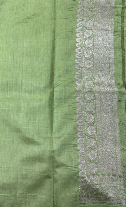 Pure Chiniya Silk Saree Apple Green Colored Elegantly Paired with a Gold Zari Border.