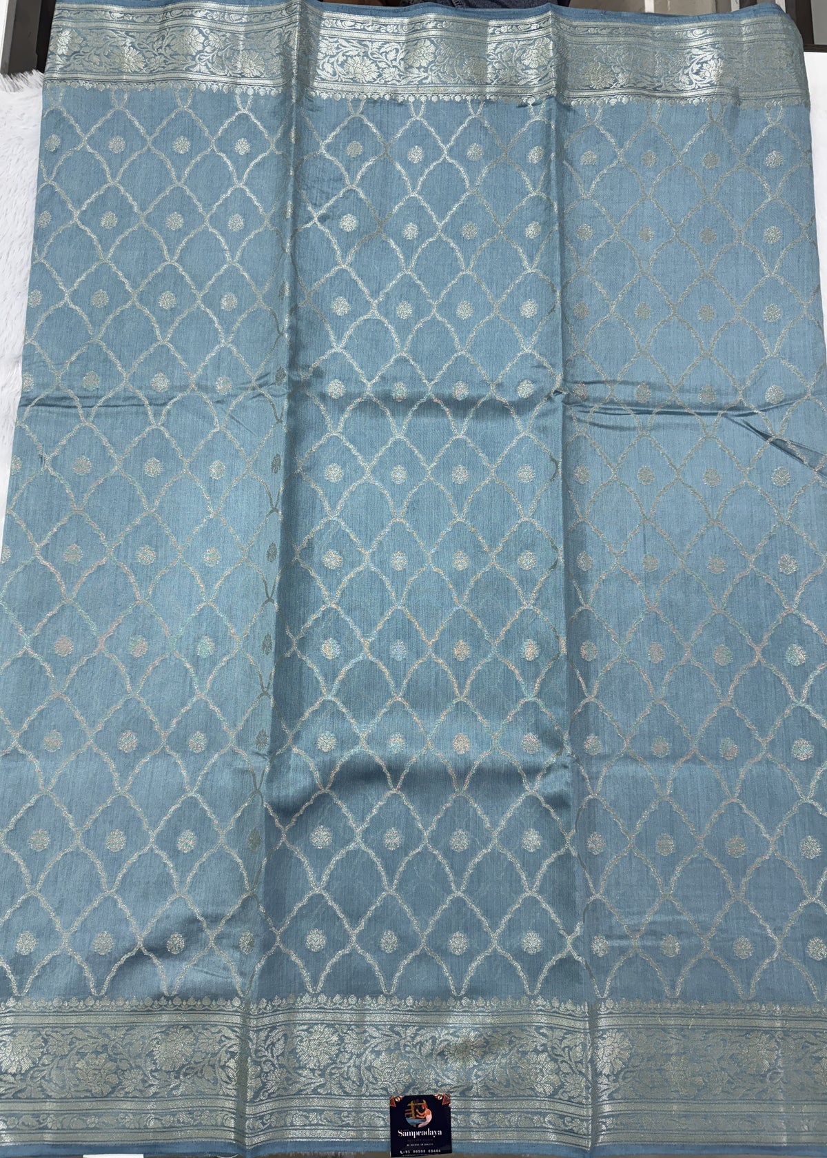 Pure Chiniya Silk Saree Ice Blue Colored Elegantly Paired with a Gold Zari Border