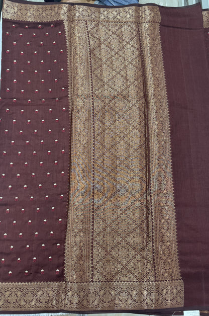 Pure Chiniya Silk Saree Brown Colored Elegantly Paired with a Gold Zari Border.