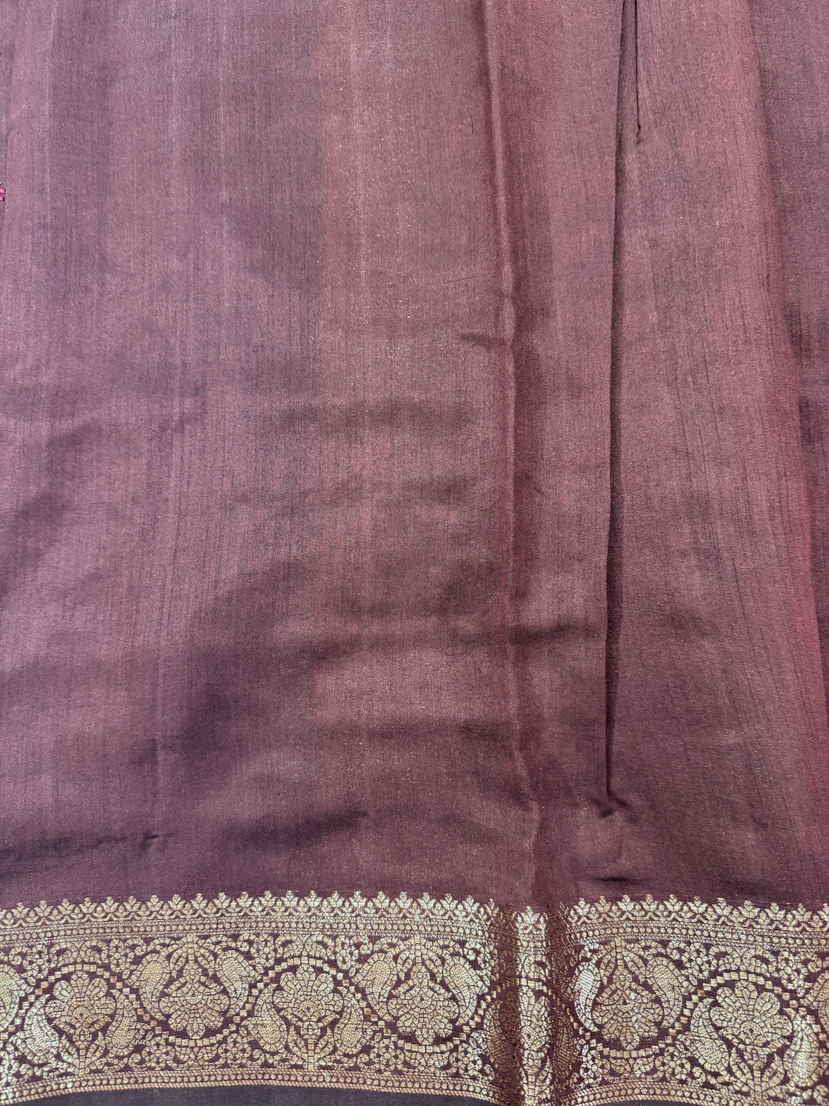 Pure Chiniya Silk Saree Brown Colored Elegantly Paired with a Gold Zari Border.