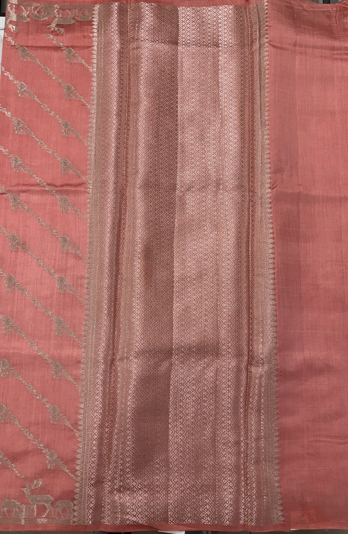 Pure Chiniya Silk Saree Peach Colored Elegantly Paired with a Gold Zari Border.