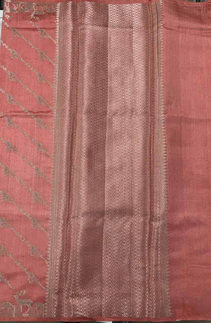 Pure Chiniya Silk Saree Peach Colored Elegantly Paired with a Gold Zari Border.