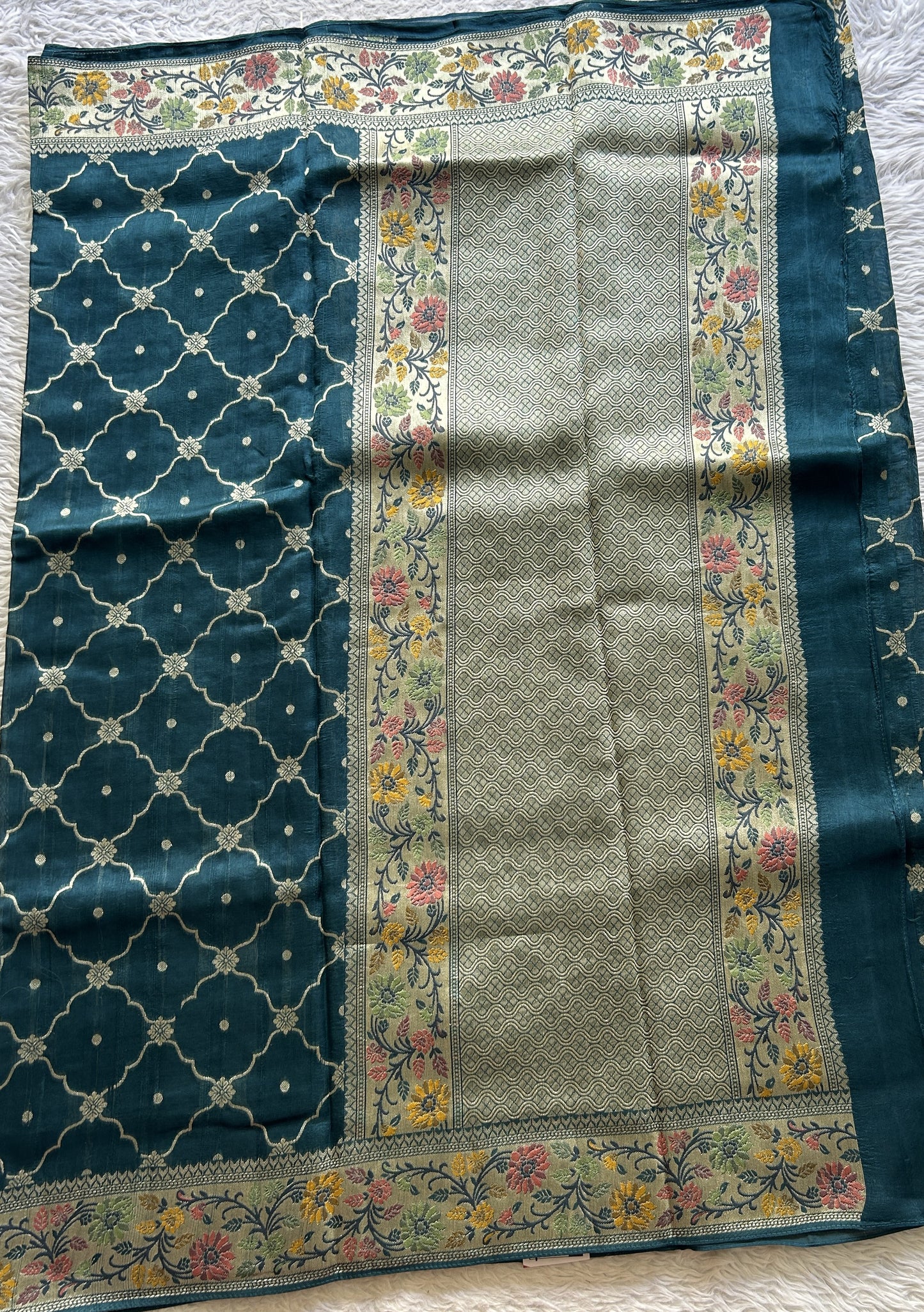 Banarasi Tussar Georgette Saree Peacock Blue Colored Complemented with a Minakari border. - Sampradaya Designer Studio