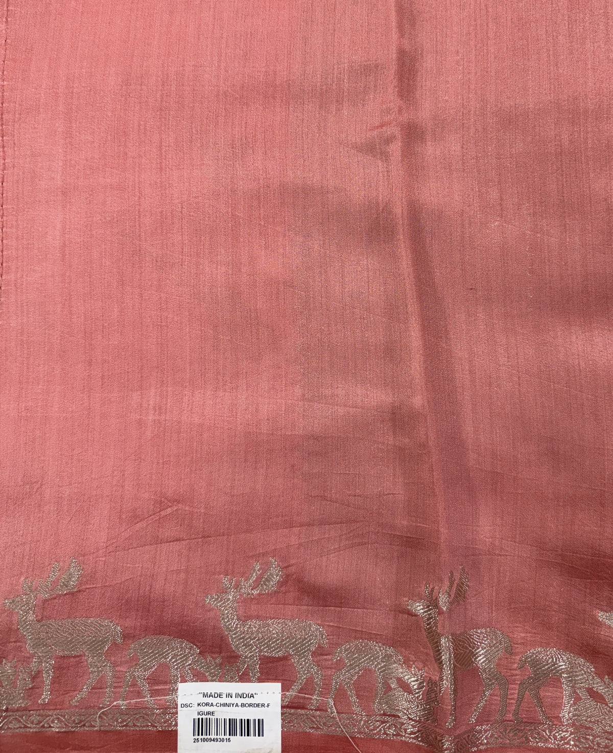 Pure Chiniya Silk Saree Peach Colored Elegantly Paired with a Gold Zari Border.