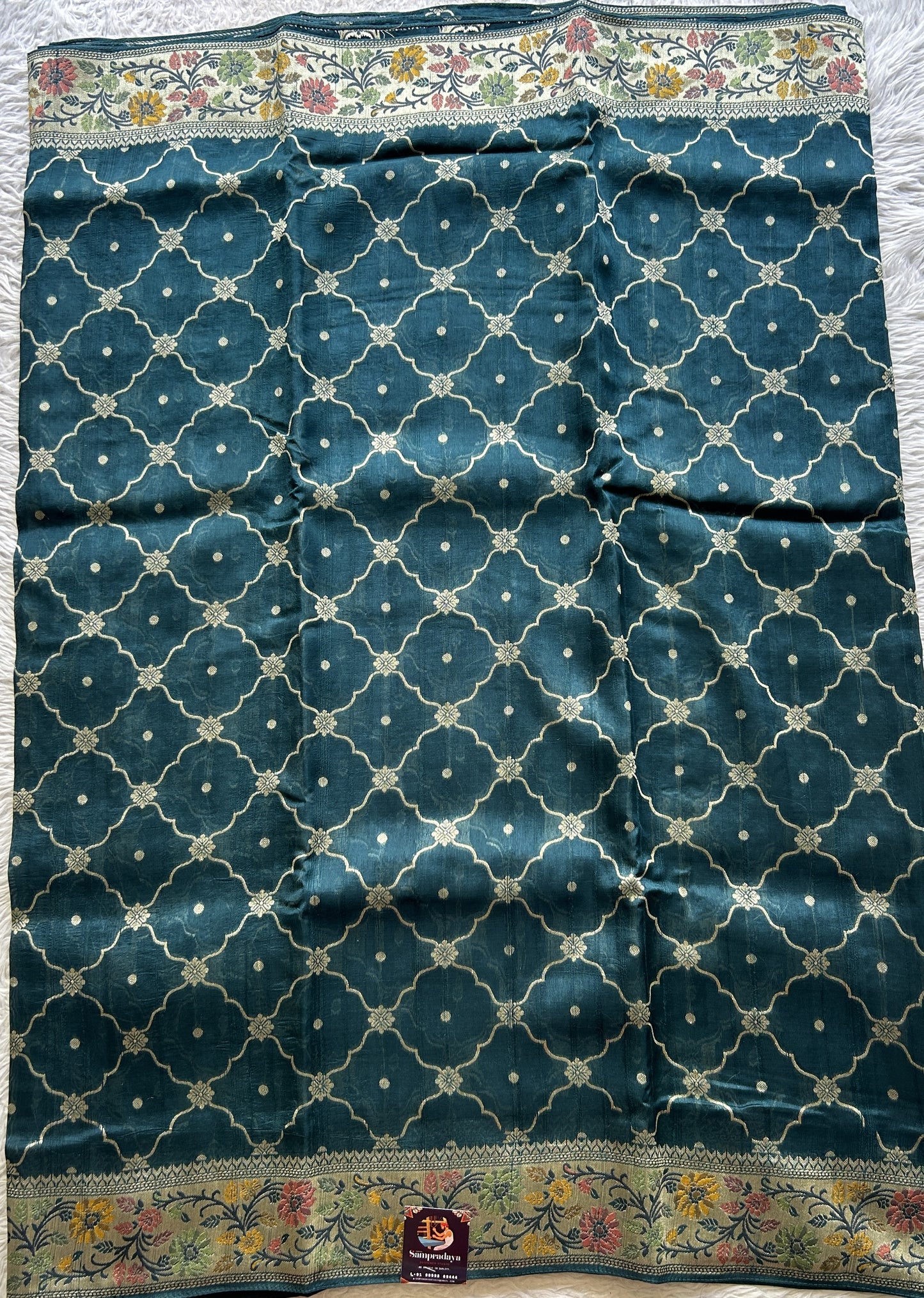 Banarasi Tussar Georgette Saree Peacock Blue Colored Complemented with a Minakari border. - Sampradaya Designer Studio