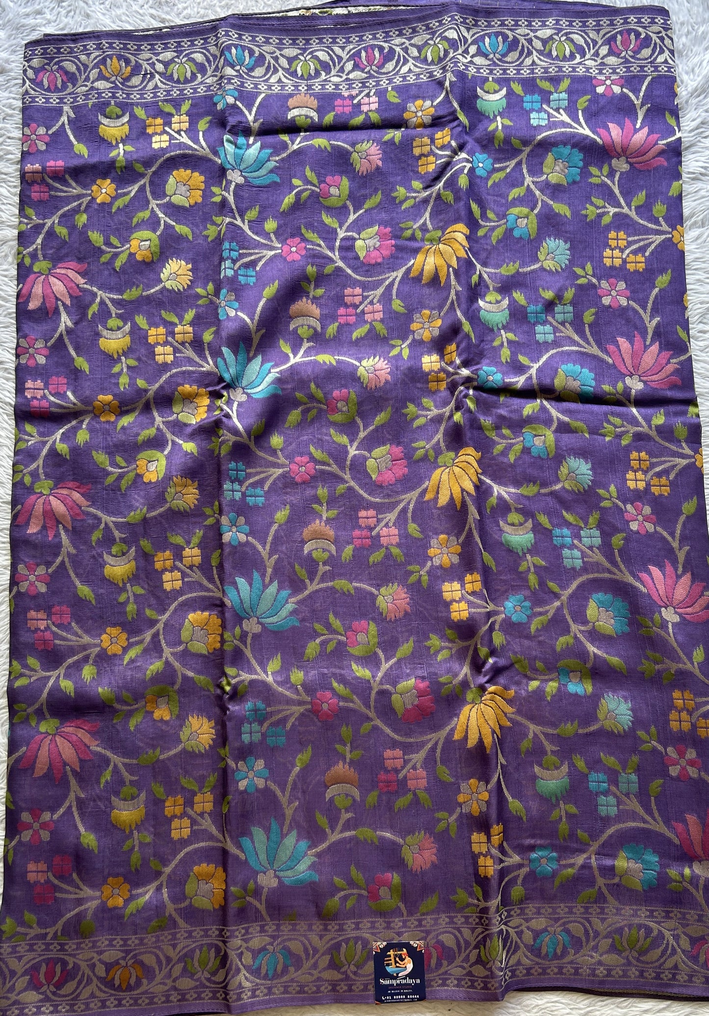 Banarasi Tussar Georgette Saree Deep Lilac Colored Complemented with a Minakari border. - Sampradaya Designer Studio