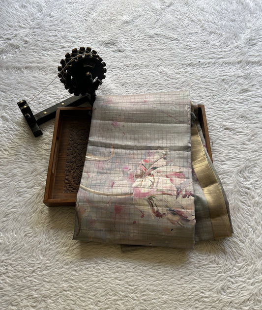 Semi Tussar Saree Light Ash Colored complemented with a Zari Border. - Sampradaya Designer Studio