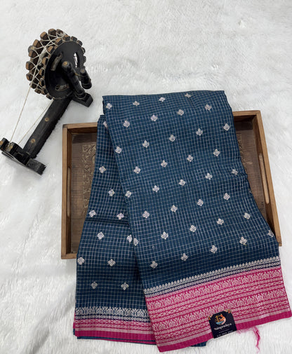 Banarasi Fancy Saree Dark Teal Blue Colored Complemented with a Yellow Zari Border.