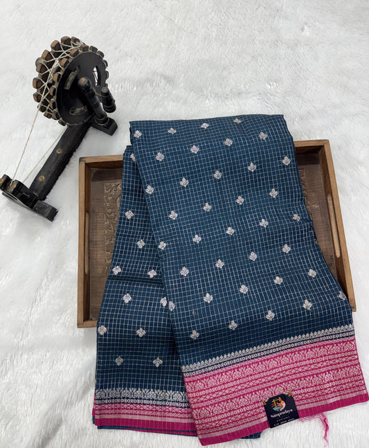 Banarasi Fancy Saree Dark Teal Blue Colored Complemented with a Yellow Zari Border.