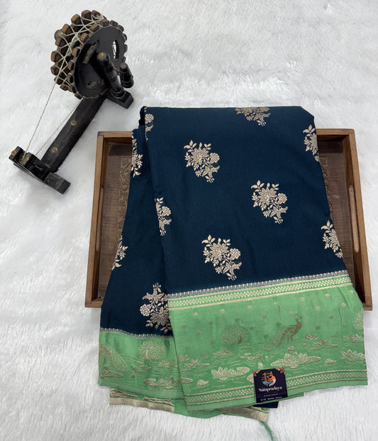Banarasi Fancy Saree Dark Teal Blue Blue Colored Complemented with a Light Green Zari Border.