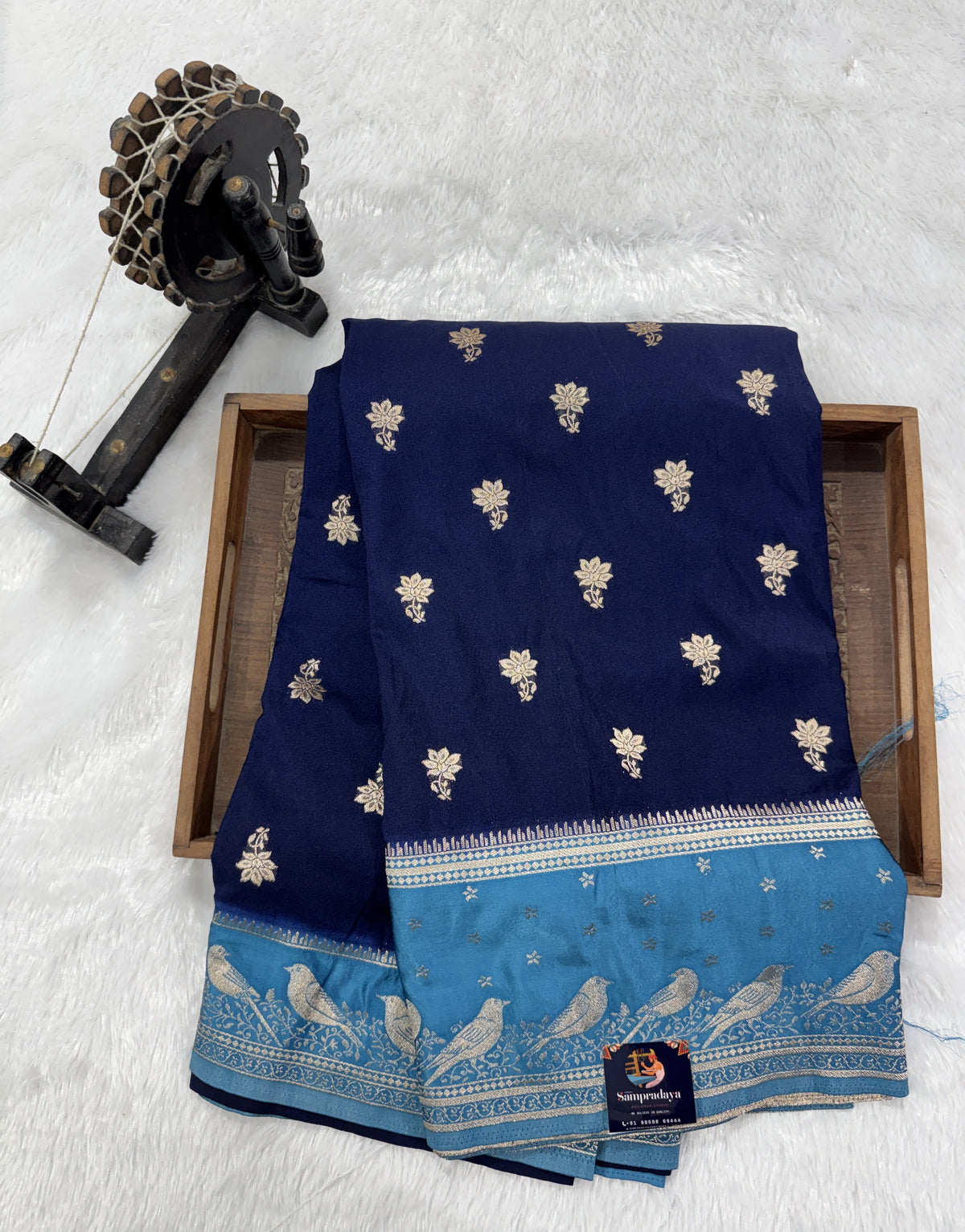 Banarasi Fancy Saree Navy Blue Colored Complemented with a Blue Zari Border.