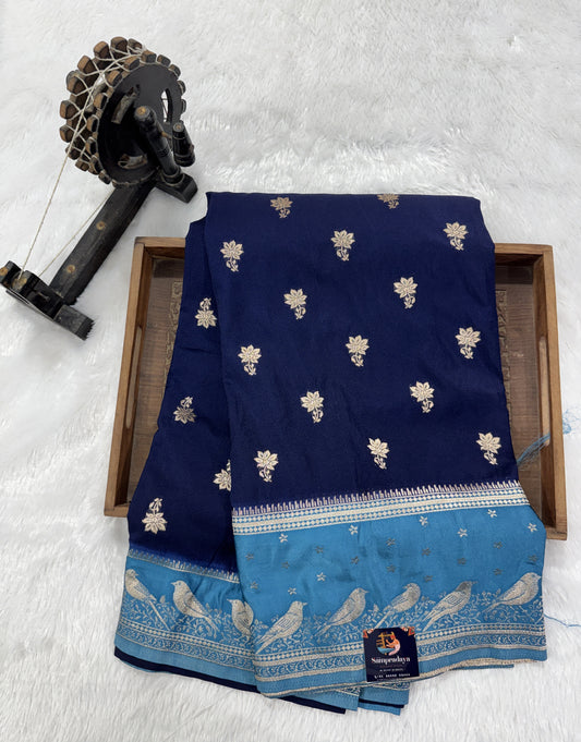 Banarasi Fancy Saree Navy Blue Colored Complemented with a Blue Zari Border.
