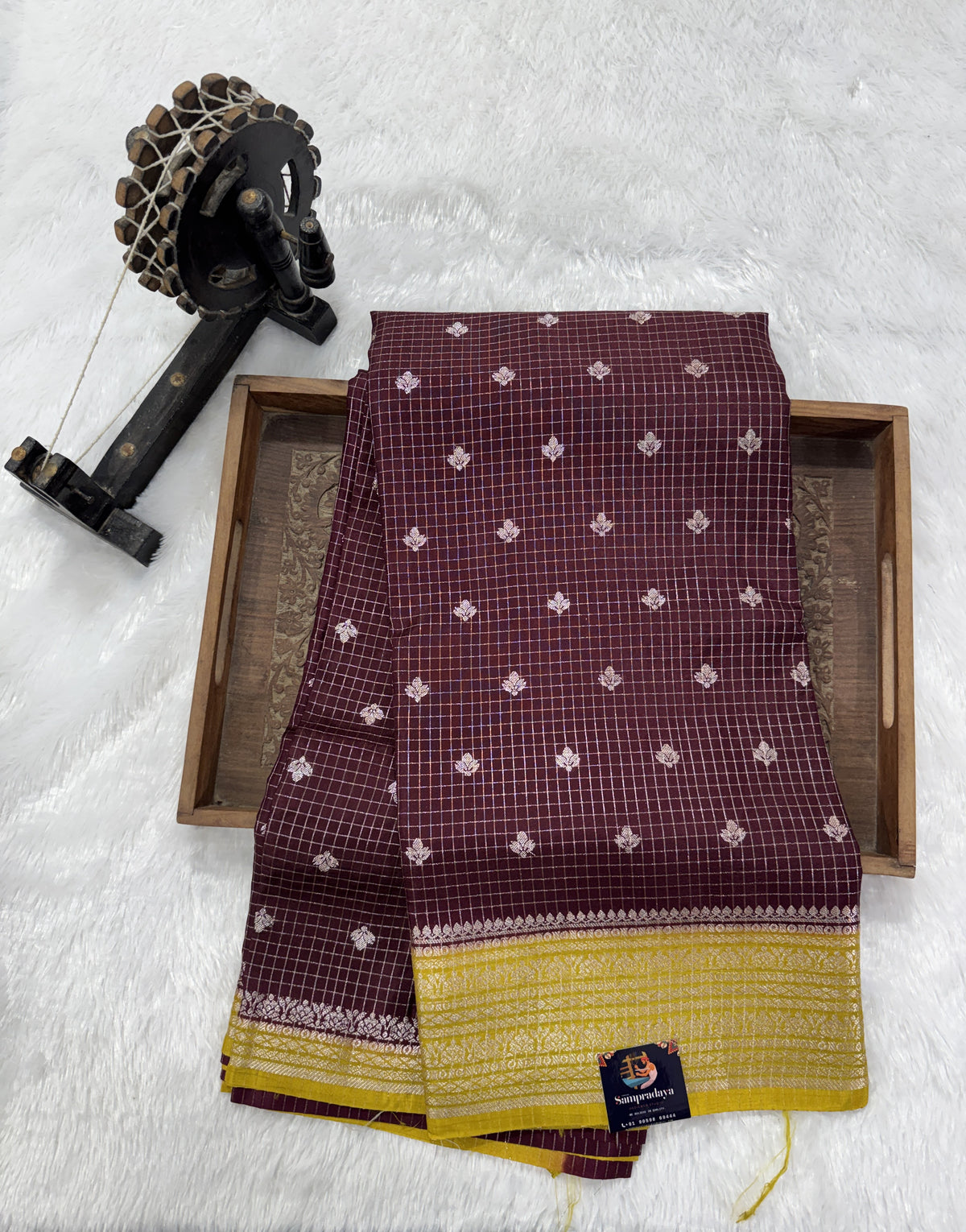 Banarasi Fancy Saree Brown Colored Complemented with a Yellow Zari Border.