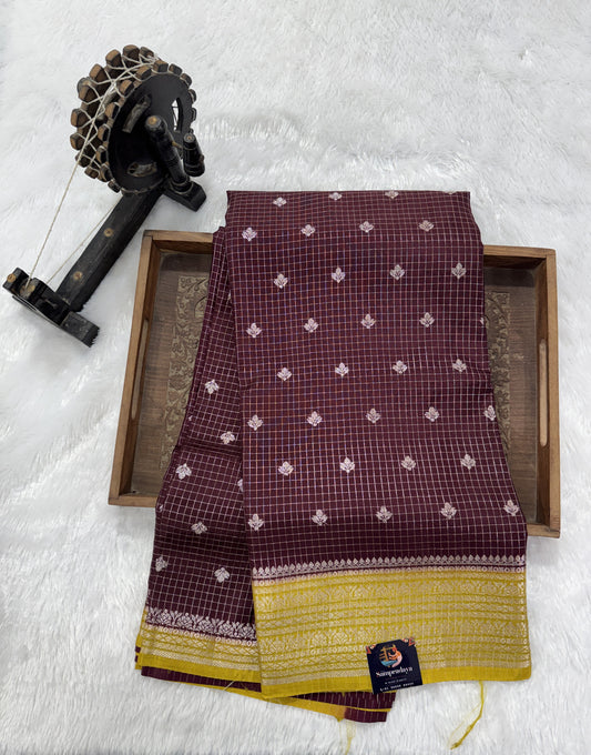 Banarasi Fancy Saree Brown Colored Complemented with a Yellow Zari Border.