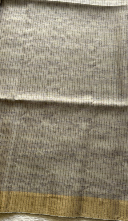 Semi Tussar Saree Light Ash Colored complemented with a Zari Border. - Sampradaya Designer Studio