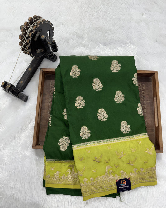 Banarasi Fancy Saree Bottle Green Colored Complemented with a Light Green Zari Border.