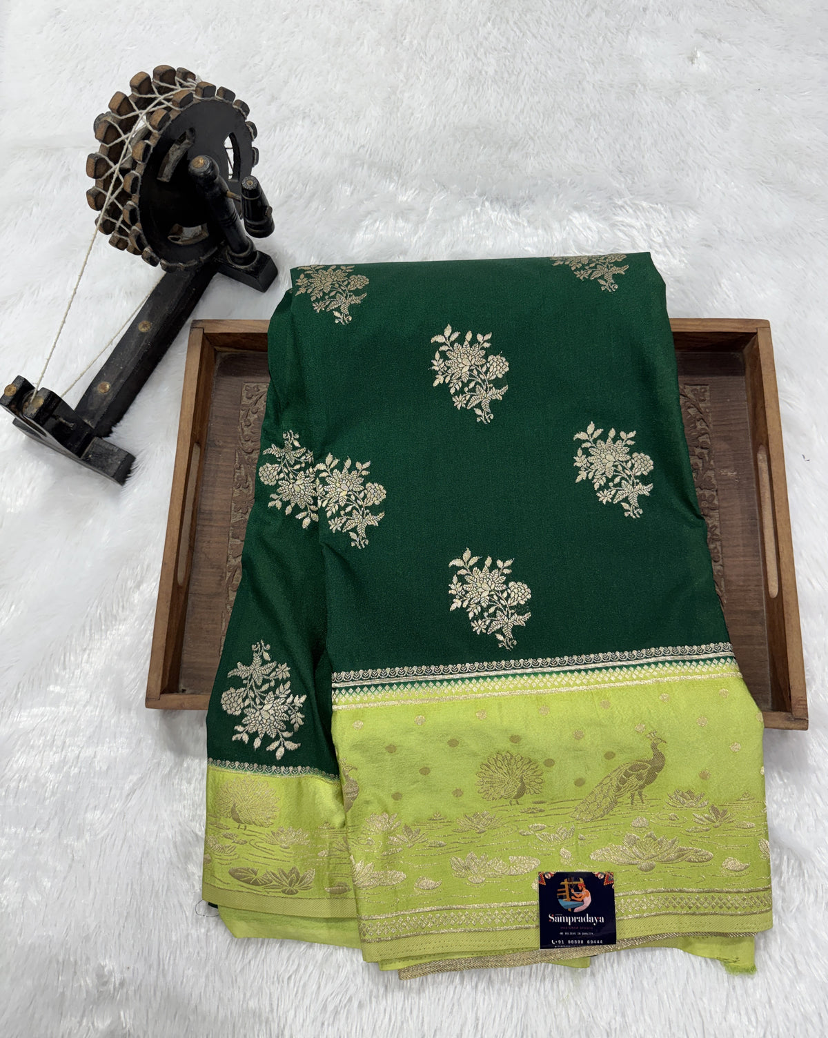 Banarasi Fancy Saree Bottle Green Colored Complemented with a Light Green Zari Border.