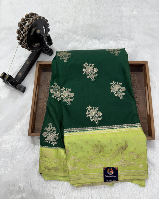 Banarasi Fancy Saree Bottle Green Colored Complemented with a Light Green Zari Border.