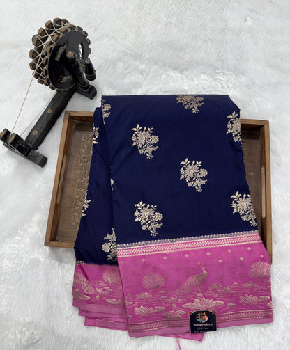 Banarasi Fancy Saree Navy Blue Colored Complemented with a Pink Zari Border.