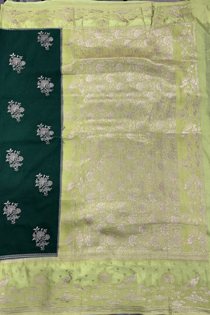 Banarasi Fancy Saree Bottle Green Colored Complemented with a Light Green Zari Border.