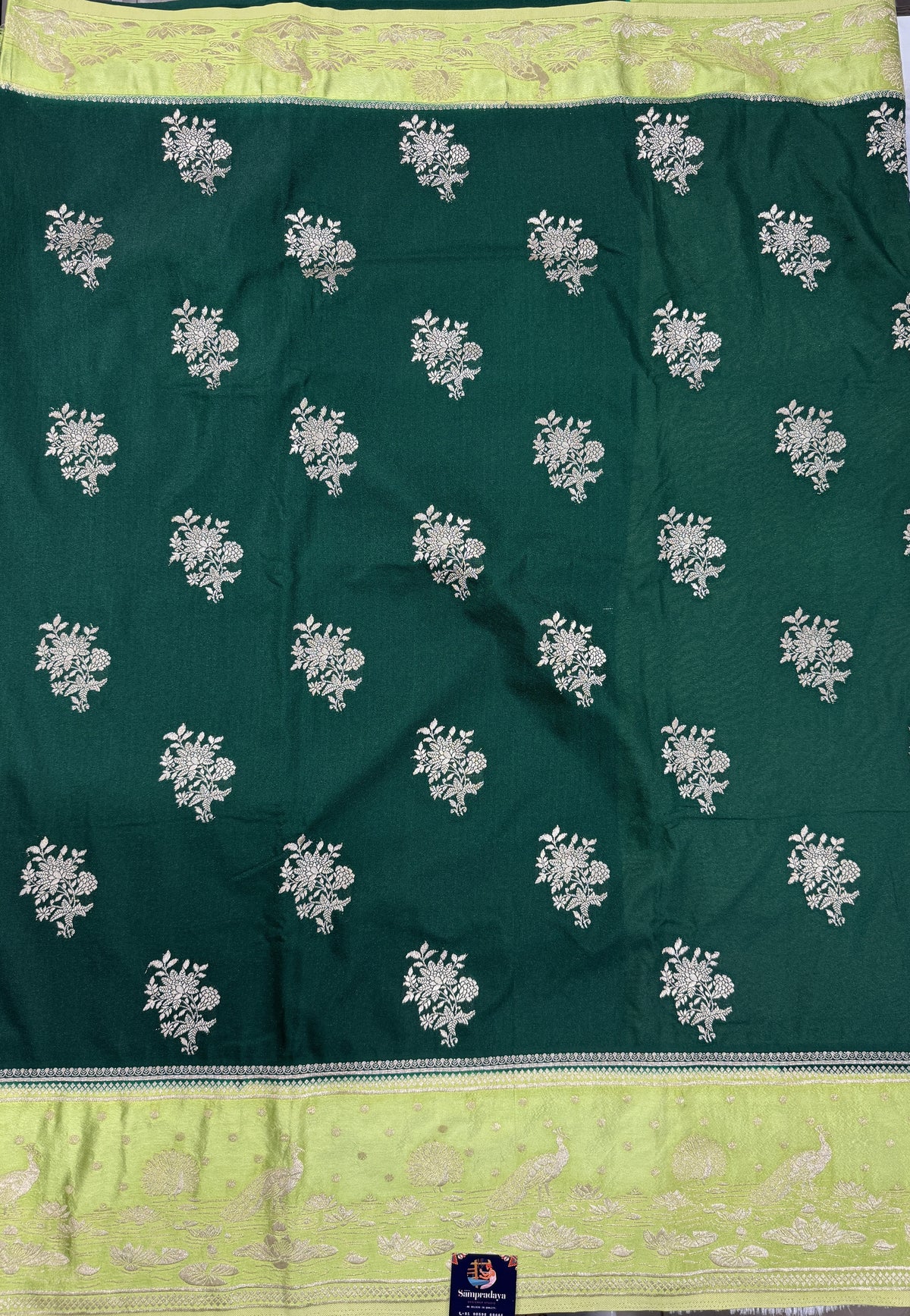 Banarasi Fancy Saree Bottle Green Colored Complemented with a Light Green Zari Border.