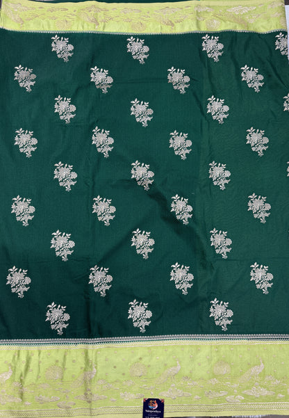 Banarasi Fancy Saree Bottle Green Colored Complemented with a Light Green Zari Border.