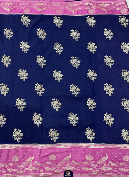 Banarasi Fancy Saree Navy Blue Colored Complemented with a Pink Zari Border.