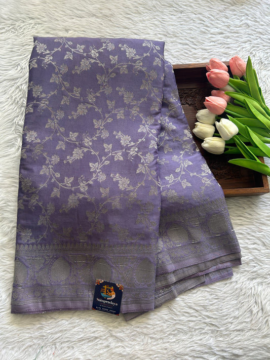 Semi Georgette Saree Lilac Colored Complemented with a Zari Border. - Sampradaya Designer Studio