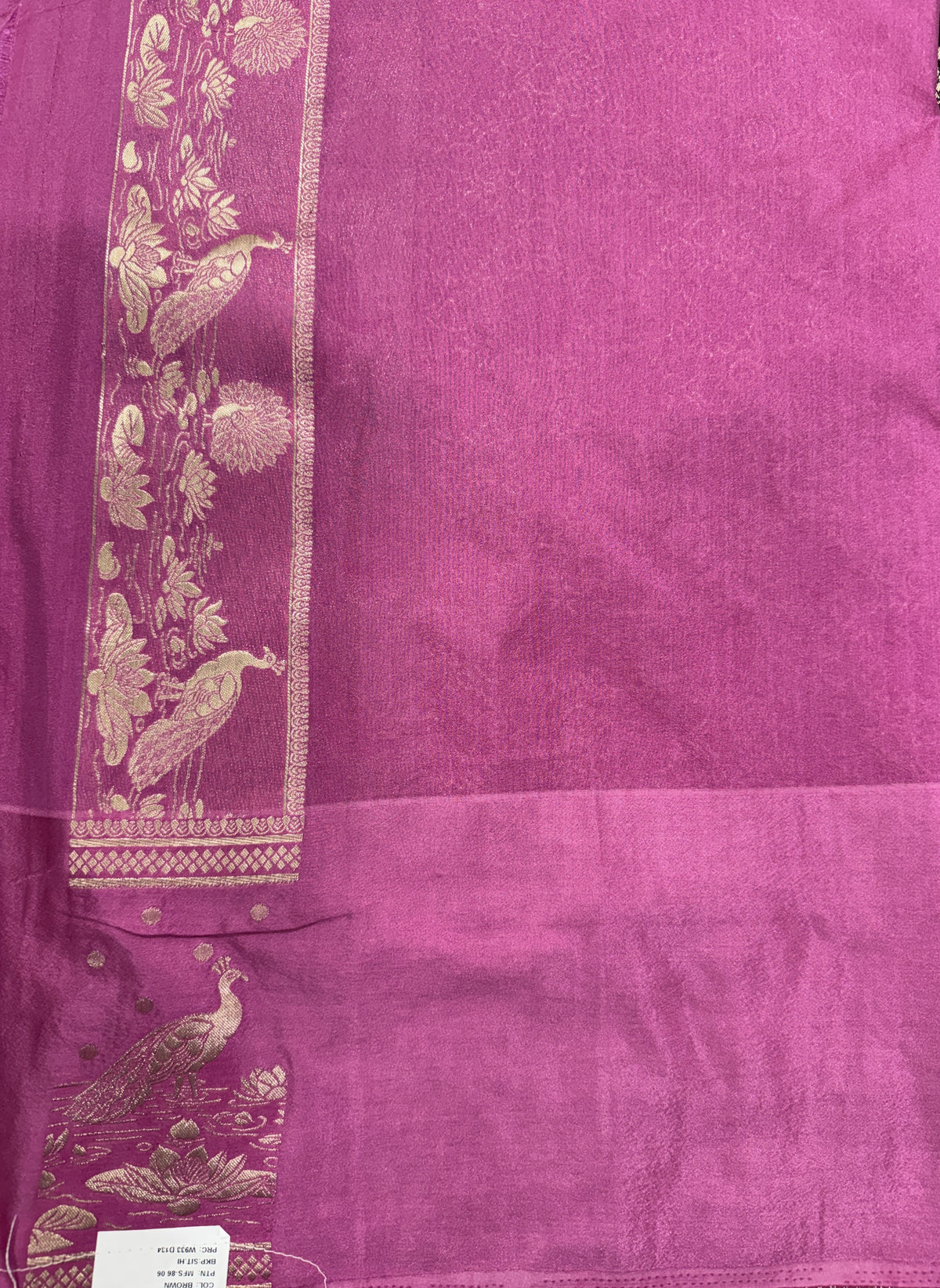 Banarasi Fancy Saree Brown Colored Complemented with a Pink Zari Border.