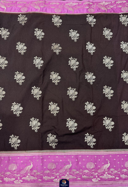 Banarasi Fancy Saree Brown Colored Complemented with a Pink Zari Border.