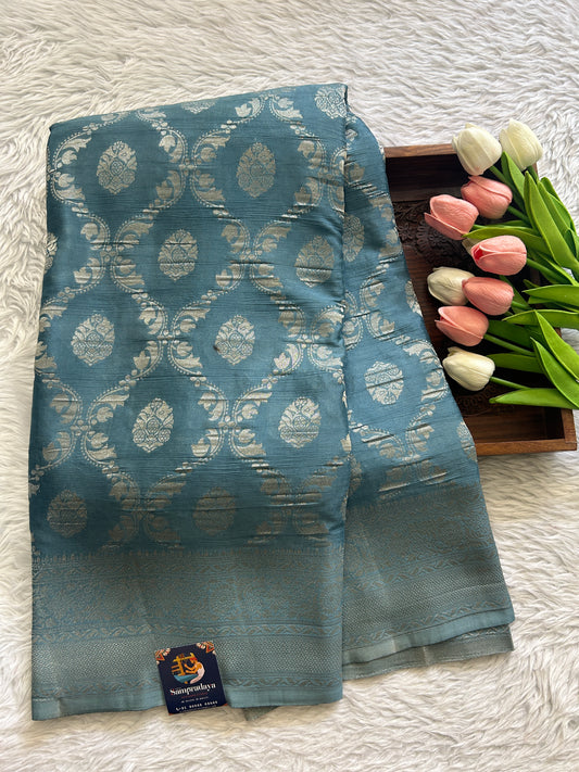 Semi Georgette Saree Sea Blue Colored Complemented with a Zari Border. - Sampradaya Designer Studio