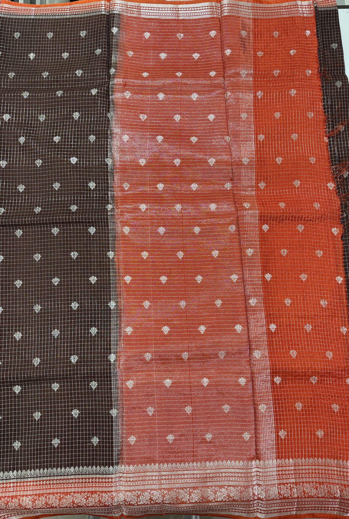 Banarasi Fancy Saree Brown Colored Complemented with a Orange Zari Border.