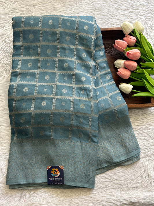 Semi Georgette Saree Aqua Blue Colored Complemented with a Zari Border. - Sampradaya Designer Studio