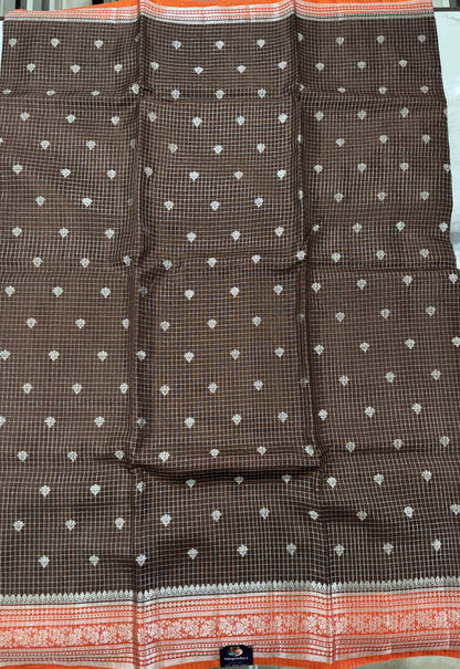 Banarasi Fancy Saree Brown Colored Complemented with a Orange Zari Border.