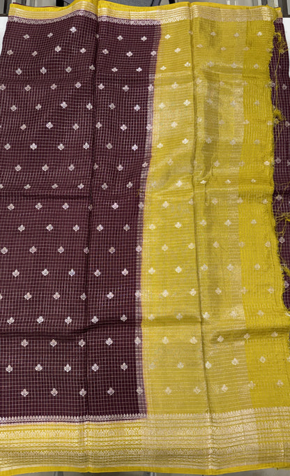 Banarasi Fancy Saree Brown Colored Complemented with a Yellow Zari Border.