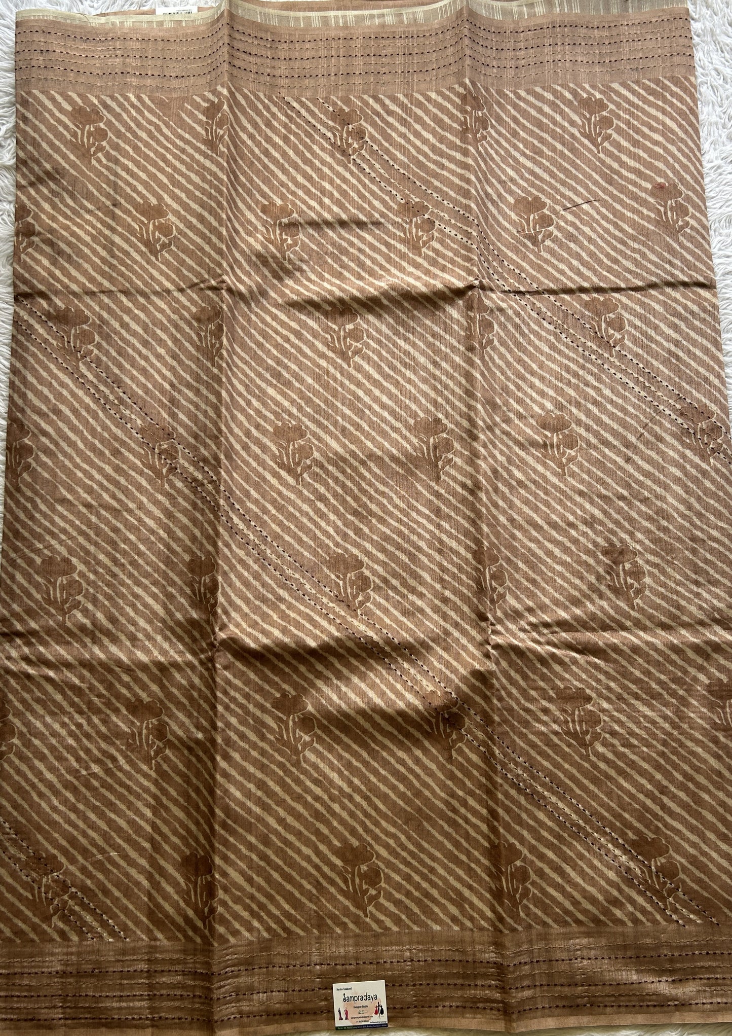 Semi Tussar Saree Light Brown Colored complemented with a Running Stich Border. - Sampradaya Designer Studio
